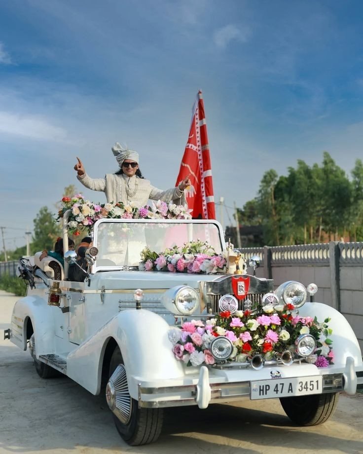 Vintage open-top car with floral décor